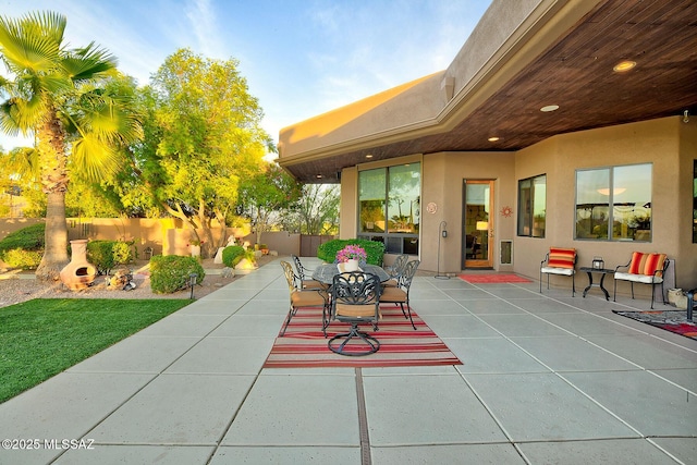 view of patio featuring fence