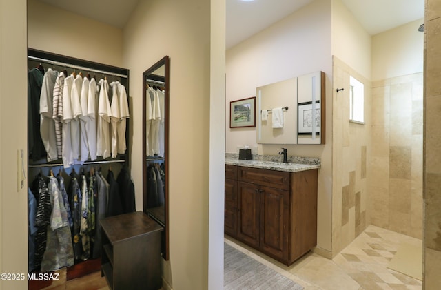 9971 N Desert Sky Rd, Oro Valley, AZ 85737 - full bath with a spacious closet, vanity, a walk in shower, and tile patterned flooring
