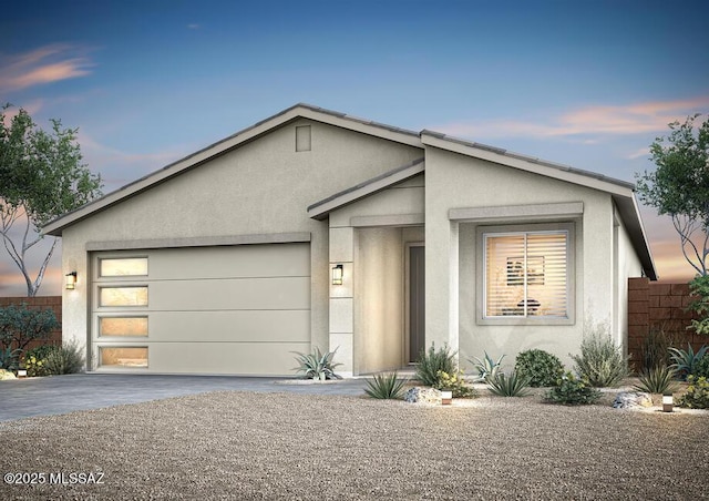 7706 S Wild Prairie Dr, Tucson, AZ 85757 - view of front facade featuring stucco siding, asphalt driveway, and an attached garage