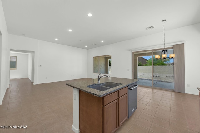 62742 E Oakwood Dr, Saddlebrooke, AZ 85739 - kitchen with a sink, stainless steel dishwasher, light tile patterned floors, dark stone counters, and recessed lighting