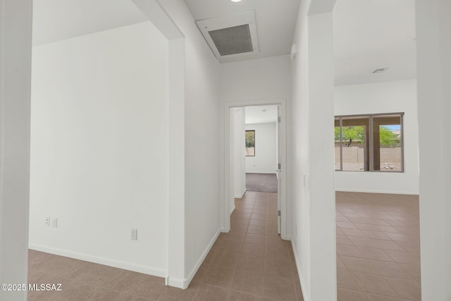 62742 E Oakwood Dr, Saddlebrooke, AZ 85739 - corridor featuring tile patterned flooring and baseboards