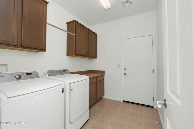 62742 E Oakwood Dr, Saddlebrooke, AZ 85739 - laundry area with cabinet space, washing machine and clothes dryer, and baseboards