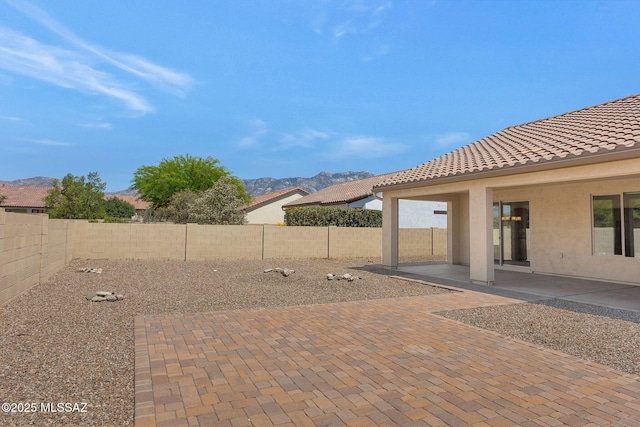 62742 E Oakwood Dr, Saddlebrooke, AZ 85739 - fenced backyard with a mountain view and a patio area