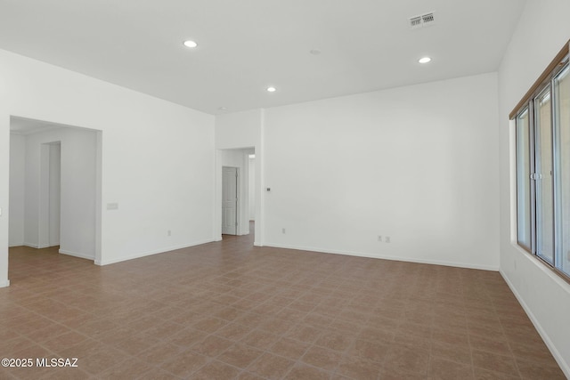 62742 E Oakwood Dr, Saddlebrooke, AZ 85739 - spare room with recessed lighting, healthy amount of natural light, baseboards, and tile patterned floors