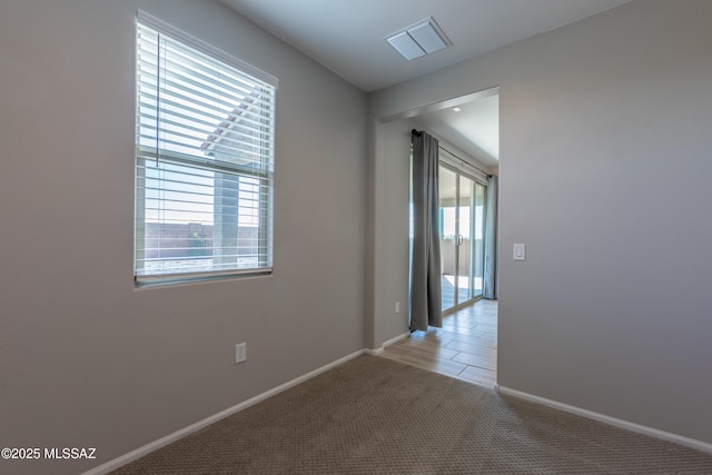 9734 E Miller Peak Trl, Tucson, AZ 85747 - unfurnished room with light carpet and baseboards