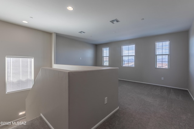 9734 E Miller Peak Trl, Tucson, AZ 85747 - unfurnished room with dark colored carpet, baseboards, and recessed lighting