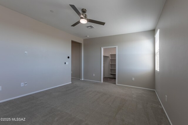 9734 E Miller Peak Trl, Tucson, AZ 85747 - carpeted empty room with a ceiling fan and baseboards