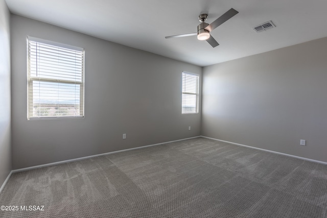 9734 E Miller Peak Trl, Tucson, AZ 85747 - carpeted spare room featuring ceiling fan and baseboards