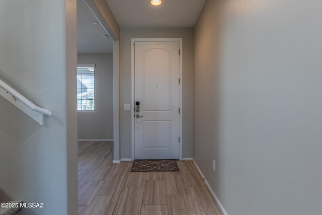 9734 E Miller Peak Trl, Tucson, AZ 85747 - doorway to outside featuring baseboards, light wood-type flooring, and recessed lighting