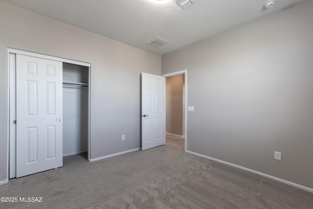 9734 E Miller Peak Trl, Tucson, AZ 85747 - unfurnished bedroom with carpet floors, a closet, and baseboards