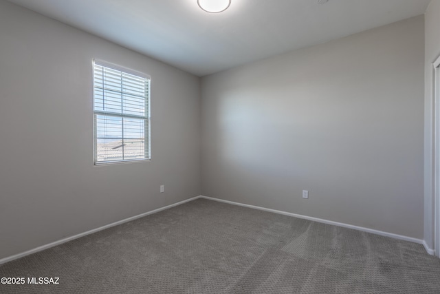 9734 E Miller Peak Trl, Tucson, AZ 85747 - unfurnished room featuring dark carpet and baseboards