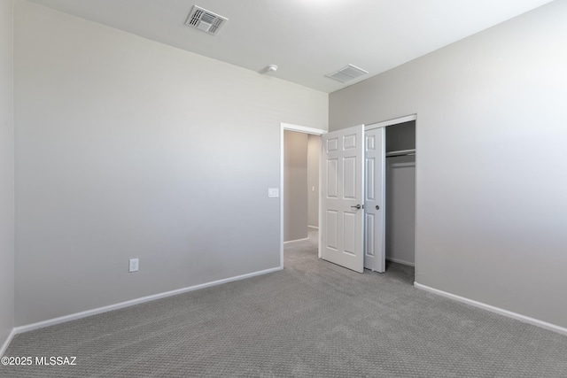 9734 E Miller Peak Trl, Tucson, AZ 85747 - unfurnished bedroom with carpet flooring, a closet, and baseboards