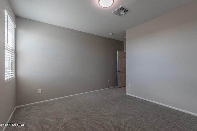 9734 E Miller Peak Trl, Tucson, AZ 85747 - empty room with carpet flooring and baseboards