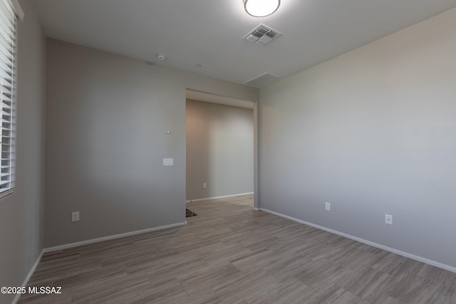 9734 E Miller Peak Trl, Tucson, AZ 85747 - unfurnished room featuring wood finished floors and baseboards