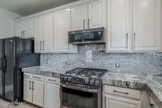 3526 E Farrier Dr, Tucson, AZ 85739 - kitchen with appliances with stainless steel finishes, white cabinetry, backsplash, and light stone counters
