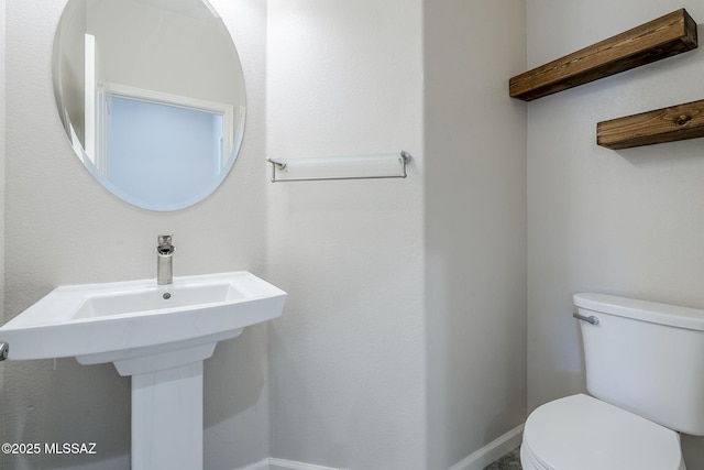3526 E Farrier Dr, Tucson, AZ 85739 - half bathroom featuring toilet and baseboards