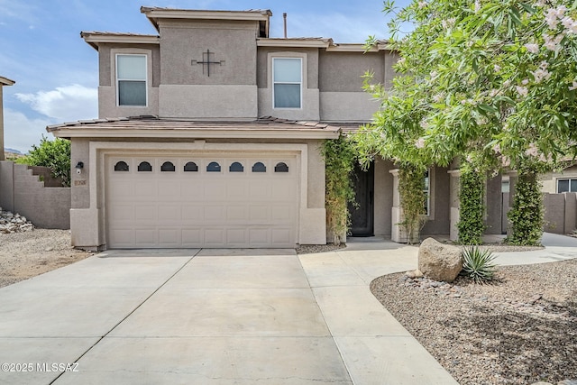 3526 E Farrier Dr, Tucson, AZ 85739 - view of front facade with stucco siding, driveway, a garage, fence, and a tiled roof