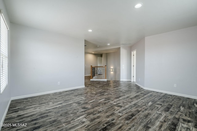 3526 E Farrier Dr, Tucson, AZ 85739 - unfurnished room with dark wood-style floors, recessed lighting, baseboards, and healthy amount of natural light