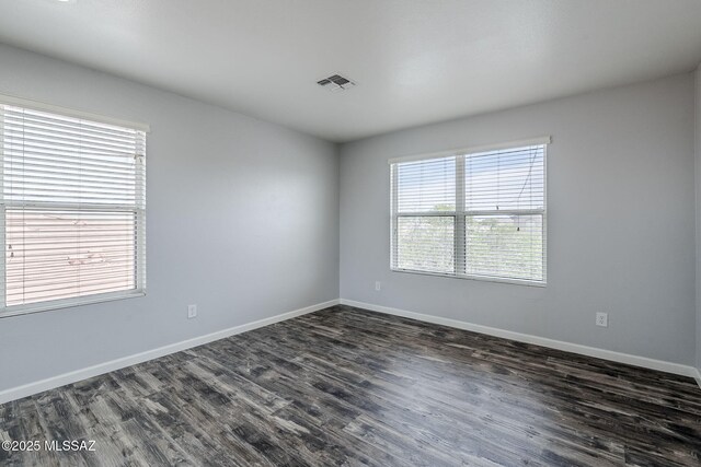 3526 E Farrier Dr, Tucson, AZ 85739 - unfurnished room featuring dark wood-style floors and baseboards