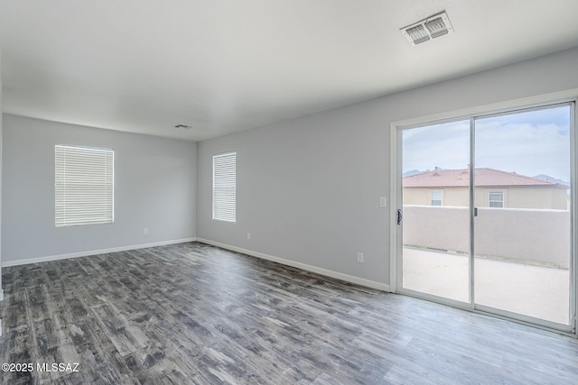 3526 E Farrier Dr, Tucson, AZ 85739 - unfurnished room with dark wood-style floors and baseboards