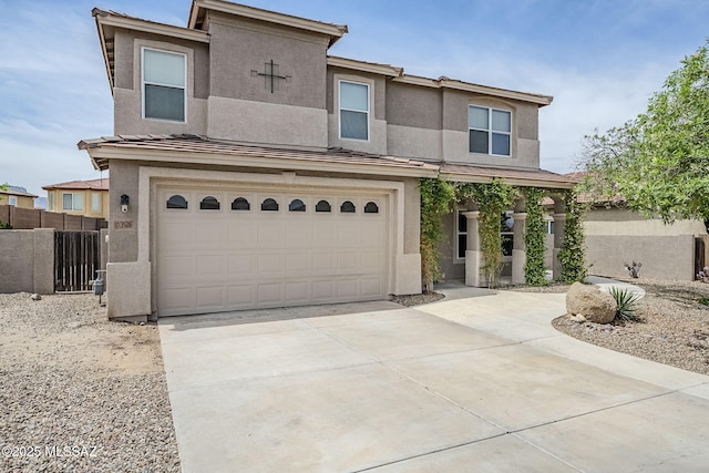 3526 E Farrier Dr, Tucson, AZ 85739 - view of front of house featuring stucco siding, a garage, driveway, and fence