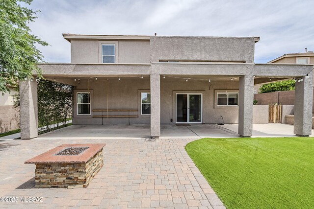 3526 E Farrier Dr, Tucson, AZ 85739 - rear view of house featuring an outdoor fire pit, a patio area, and stucco siding