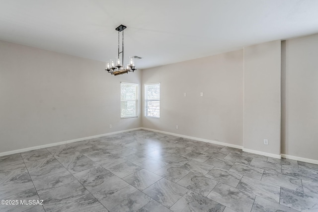 3526 E Farrier Dr, Tucson, AZ 85739 - spare room with a chandelier, marble look tile flooring, and baseboards