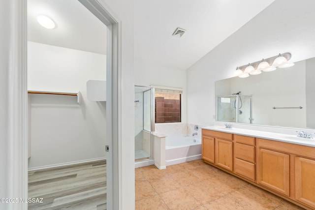 11874 N Verismo Dr, Tucson, AZ 85737 - bathroom with a shower stall, a garden tub, a walk in closet, double vanity, and vaulted ceiling