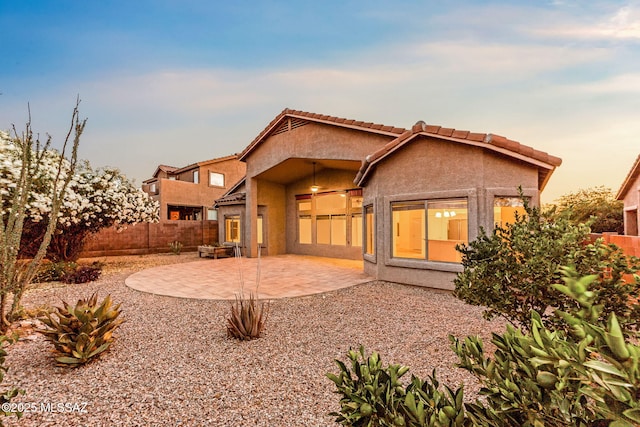 11874 N Verismo Dr, Tucson, AZ 85737 - back of property with a fenced backyard, a patio, stucco siding, and a tiled roof
