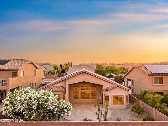 11874 N Verismo Dr, Tucson, AZ 85737 - view of front facade featuring a tiled roof, stucco siding, and a residential view