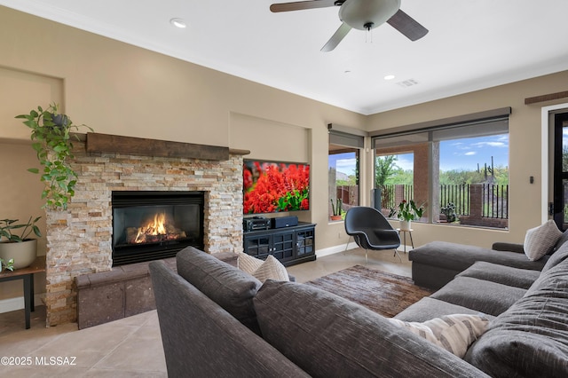 1808 W Quartz Rock Pl, Tucson, AZ 85737 - living area featuring a stone fireplace, ornamental molding, a ceiling fan, light tile patterned flooring, and recessed lighting