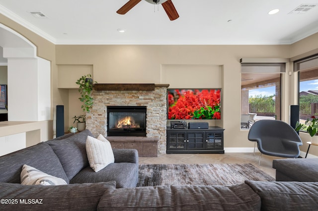 1808 W Quartz Rock Pl, Tucson, AZ 85737 - tiled living area featuring ceiling fan, crown molding, a stone fireplace, baseboards, and recessed lighting