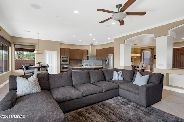 1808 W Quartz Rock Pl, Tucson, AZ 85737 - living area featuring arched walkways, a ceiling fan, recessed lighting, tile patterned flooring, and ornamental molding