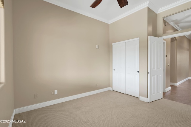 1808 W Quartz Rock Pl, Tucson, AZ 85737 - unfurnished bedroom featuring crown molding, light colored carpet, a closet, baseboards, and ceiling fan