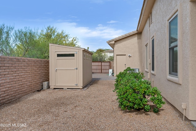 1808 W Quartz Rock Pl, Tucson, AZ 85737 - fenced backyard featuring a storage shed and an outdoor structure