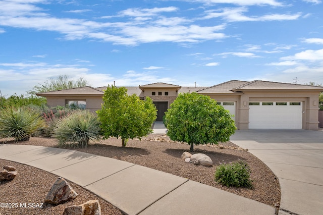 1808 W Quartz Rock Pl, Tucson, AZ 85737 - view of front facade featuring concrete driveway, an attached garage, and stucco siding