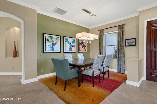 1808 W Quartz Rock Pl, Tucson, AZ 85737 - tiled dining room with ornamental molding, a chandelier, arched walkways, and baseboards