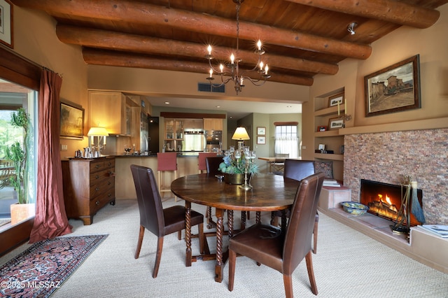 7020 N Chaparral Ave, Tucson, AZ 85718 - dining room featuring light colored carpet, wooden ceiling, a chandelier, beamed ceiling, and built in shelves