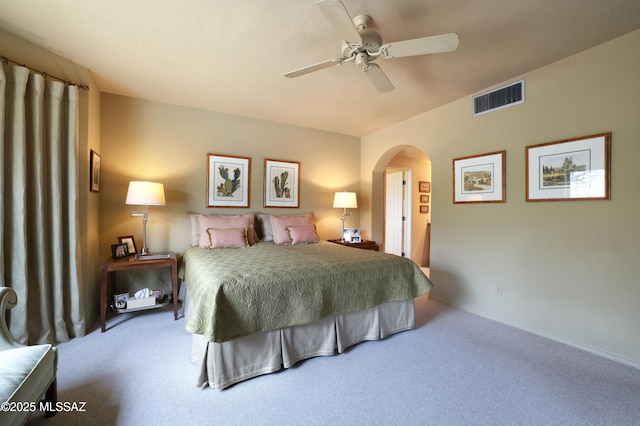 7020 N Chaparral Ave, Tucson, AZ 85718 - bedroom featuring carpet floors, arched walkways, and a ceiling fan