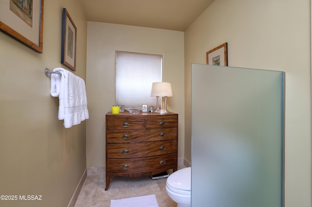 7020 N Chaparral Ave, Tucson, AZ 85718 - bathroom featuring toilet and baseboards