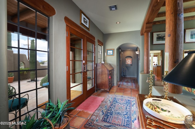 7020 N Chaparral Ave, Tucson, AZ 85718 - tiled foyer with french doors and arched walkways