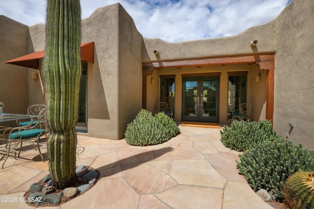 7020 N Chaparral Ave, Tucson, AZ 85718 - view of exterior entry featuring french doors and a patio