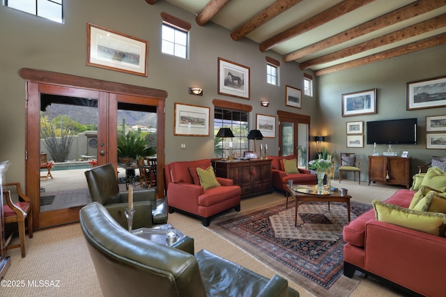 7020 N Chaparral Ave, Tucson, AZ 85718 - living area featuring french doors, a towering ceiling, carpet flooring, and beam ceiling