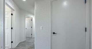 hallway with recessed lighting