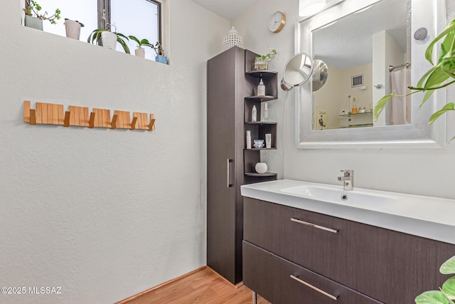 7622 E Callisto Cir Unit 204, Tucson, AZ 85715 - full bath featuring vanity and wood finished floors