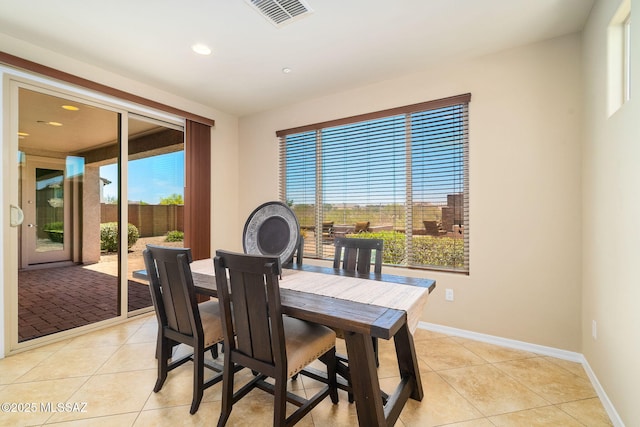 5950 S Hoptree Pl, Tucson, AZ 85747 - dining room with light tile patterned floors, recessed lighting, and baseboards