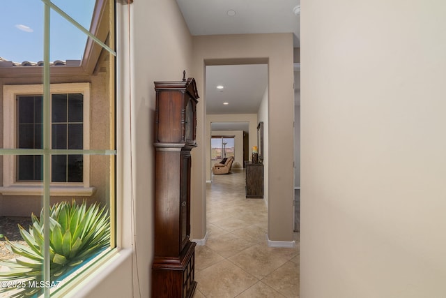 5950 S Hoptree Pl, Tucson, AZ 85747 - hall featuring light tile patterned floors and baseboards