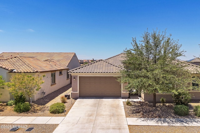5950 S Hoptree Pl, Tucson, AZ 85747 - view of front of house featuring stucco siding, a garage, concrete driveway, and a tiled roof