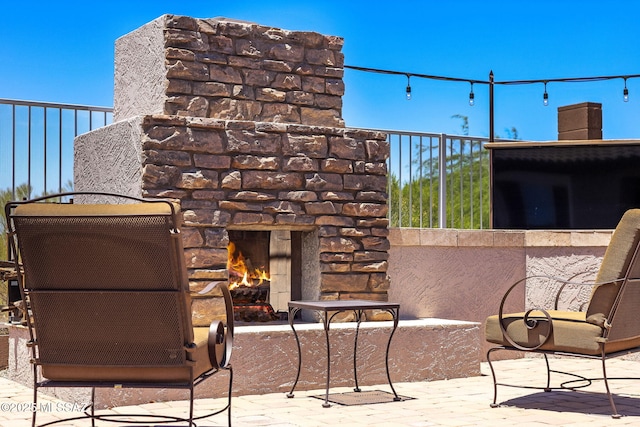 5950 S Hoptree Pl, Tucson, AZ 85747 - view of patio featuring an outdoor stone fireplace