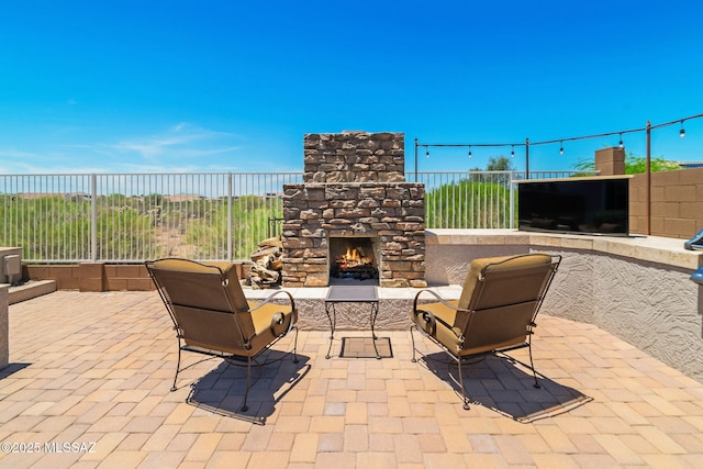 5950 S Hoptree Pl, Tucson, AZ 85747 - view of patio with an outdoor stone fireplace and fence